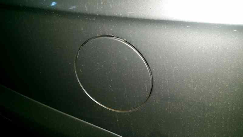 TAPA EXTERIOR COMBUSTIBLE