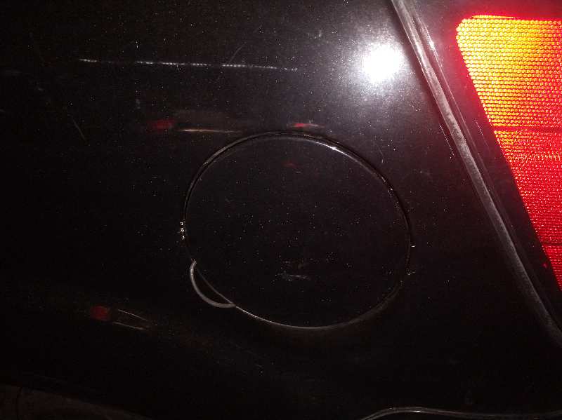 TAPA EXTERIOR COMBUSTIBLE